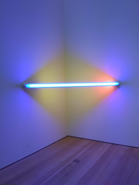 light sculpture with blue and yellow lights in a triangle configuration